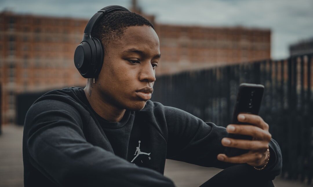 person listening to music with headphones